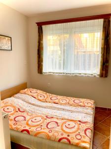 Posteľ alebo postele v izbe v ubytovaní Balaton Apartman