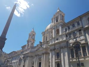 a large building with a pole in front of it at Navona Sweet Home in Rome