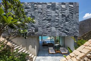a concrete house with a view of the ocean at Venity Villa Nha Trang in Nha Trang