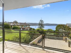 a view of the water from the balcony of a house at Apartment 29 Pacific Apartments in Lorne