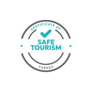 a circle of safe tourism logo on a white background at Bankerhan Hotel Galata - Adults Only Special Category in Istanbul