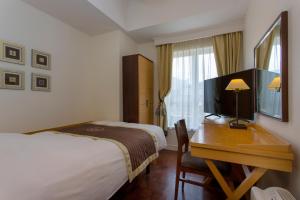 Cama o camas de una habitación en Hotel Monterey Ginza