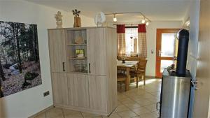 a kitchen with a large cabinet in the corner of a room at Haus Elisabeth in Neuschönau