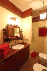 a bathroom with a sink and a toilet at Apartamenty Klejnot Sopotu in Sopot +35 photos