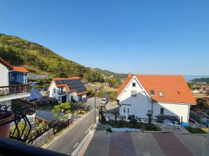 a view of a street with houses with solar panels at Namhae Manheim pension in Namhae