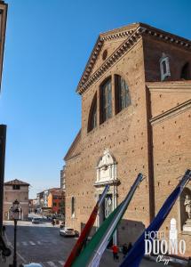 a group of flags in front of a building at Duomo Boutique Hotel in Chioggia