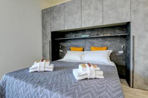 Posteľ alebo postele v izbe v ubytovaní Studio Baldo - Brenzone Holiday Apartments