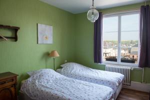 Postel nebo postele na pokoji v ubytování Entre Nous