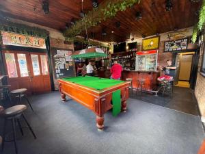a pool table in the middle of a bar at Kaneira Hotel in Culgoa