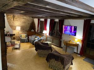 TV a/nebo společenská místnost v ubytování CHALET DE MANU