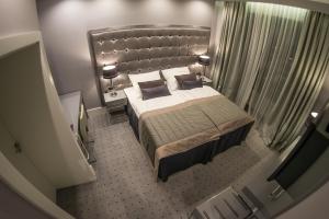 Кровать или кровати в номере NovaWisła Resort & SPA