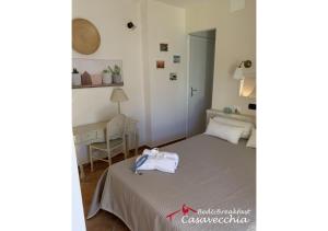 a bedroom with a bed with a bag on it at B&B Casavecchia in Gallipoli