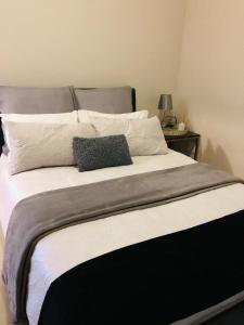 a large bed with two pillows on top of it at Umhlanga Ridge self-catering apartment in Durban