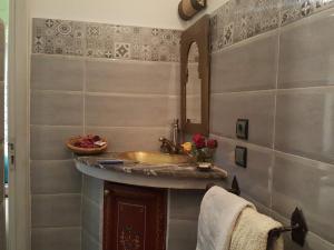 a bathroom with a sink and a counter at Riad Johnboy in Marrakesh