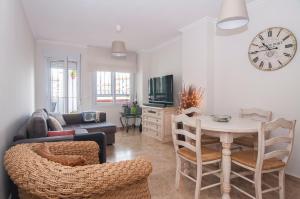 A television and/or entertainment centre at Sea view apartment, shared pools, Estepona, 60 m²