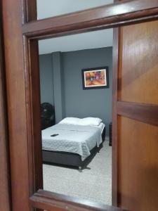 Postel nebo postele na pokoji v ubytování Suite Trujillo