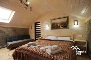 Katil atau katil-katil dalam bilik di Хамам Вілла Даросо з басейном