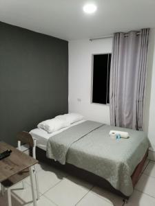 Postel nebo postele na pokoji v ubytování Suite Trujillo