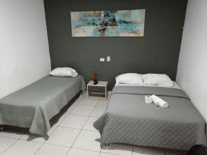 Postel nebo postele na pokoji v ubytování Suite Trujillo