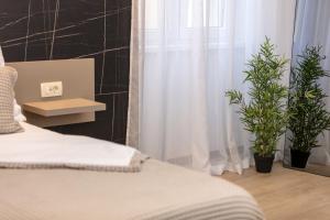 Posteľ alebo postele v izbe v ubytovaní Aborda Rooms