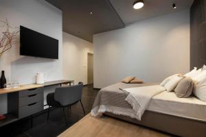 Televízia a/alebo spoločenská miestnosť v ubytovaní Aborda Rooms