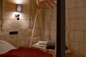 A bed or beds in a room at Sato Cave Hotel