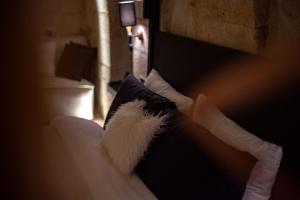 A bed or beds in a room at Sato Cave Hotel