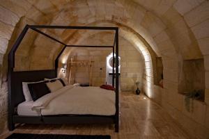 A bed or beds in a room at Sato Cave Hotel