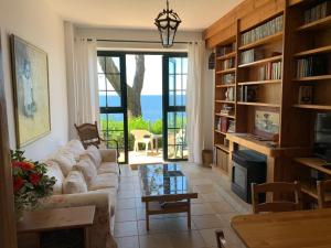 a living room with a couch and a table at Casas sobre el mar en Vigo in Vigo