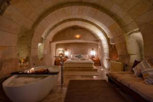 A bed or beds in a room at Sato Cave Hotel