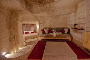 A bed or beds in a room at Sato Cave Hotel
