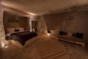 A bed or beds in a room at Sato Cave Hotel
