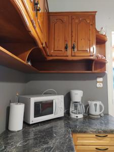 Kuchyň nebo kuchyňský kout v ubytování Aegean Blu Port House Pythagoreio