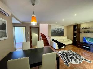 TV a/nebo společenská místnost v ubytování Villa Ocean Beach
