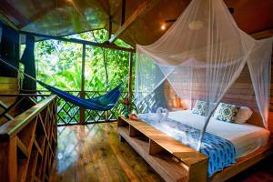 
Ein Bett oder Betten in einem Zimmer der Unterkunft Palmar Beach Lodge
