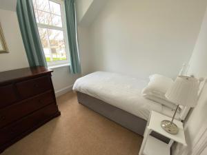 Ένα ή περισσότερα κρεβάτια σε δωμάτιο στο Stanford House +3 φωτογραφίες