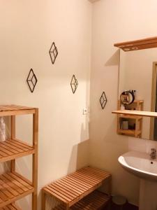 a bathroom with a sink and a toilet and a mirror at Palais des Papes - Spacious Historic Apartment in Private Mansion ! Free PARKING Nearby ! Spacieux Appartement Historique dans Hôtel Particulier ! PARKING à proximité Offert ! in Avignon