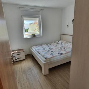 Postel nebo postele na pokoji v ubytování Bollwegs Ferienwohnungen
