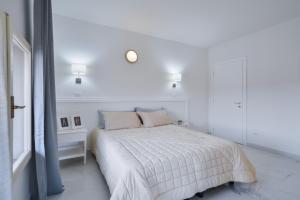Posteľ alebo postele v izbe v ubytovaní New Central Apartment