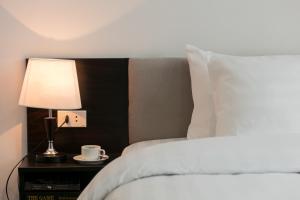 Postel nebo postele na pokoji v ubytování Hanoi Aria Central Hotel & Spa