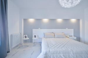 Posteľ alebo postele v izbe v ubytovaní New Central Apartment