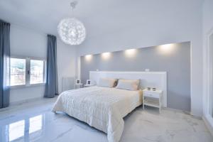 Posteľ alebo postele v izbe v ubytovaní New Central Apartment