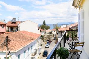 a view of a city street from a balcony at Navarino Apartment in Pylos