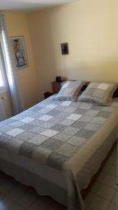 Ένα ή περισσότερα κρεβάτια σε δωμάτιο στο L'Olivette