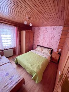 מיטה או מיטות בחדר ב-Pakrasti