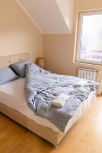Voodi või voodid majutusasutuse Apartmani Sigma toas