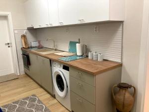 A kitchen or kitchenette at Diva Garden Apartment