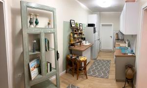 A kitchen or kitchenette at Diva Garden Apartment
