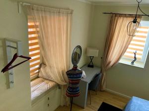 A bed or beds in a room at Diva Garden Apartment