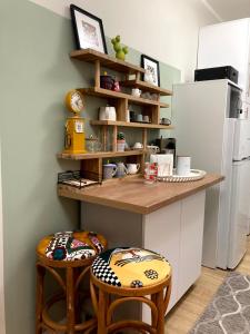 A kitchen or kitchenette at Diva Garden Apartment